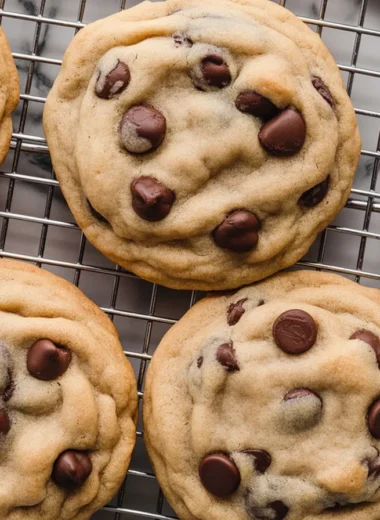 Baking chocolate chip cookie dough on a baking sheet ready for the oven.