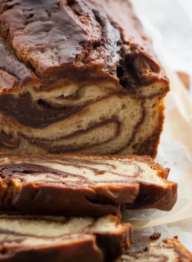 Delicious homemade loaf with a chocolate swirl, perfect for dessert or brunch.