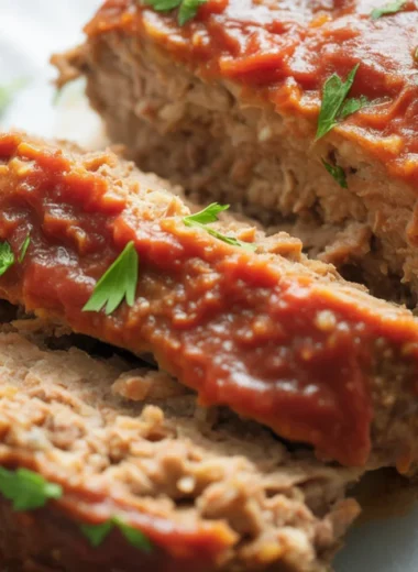Cooking meatloaf with ingredients and measuring cooking time for perfect results.