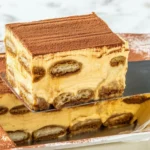 Delicious Pumpkin Spice Tiramisu layered with coffee-soaked ladyfingers and creamy pumpkin filling.