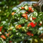 Fresh homemade Chimichurri sauce with parsley, garlic, and olive oil in a bowl.