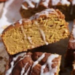 Cinnamon Roll Pumpkin Focaccia topped with vanilla glaze and cinnamon sugar filling.