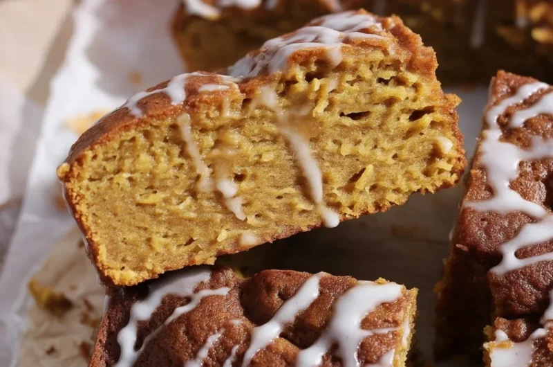 Cinnamon Roll Pumpkin Focaccia topped with vanilla glaze and cinnamon sugar filling.