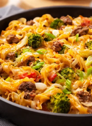 One-Pot Beef and Noodle Skillet with egg noodles, ground beef, and topped with cheese.