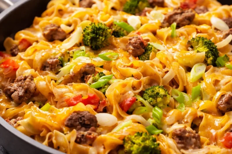 One-Pot Beef and Noodle Skillet with egg noodles, ground beef, and topped with cheese.