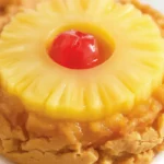 Pineapple Upside Down Sugar Cookies topped with pineapple rings and cherries