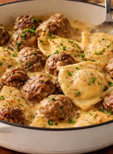 One Skillet Pierogi & Meatball Skillet with meatballs and pierogies in a creamy sauce.
