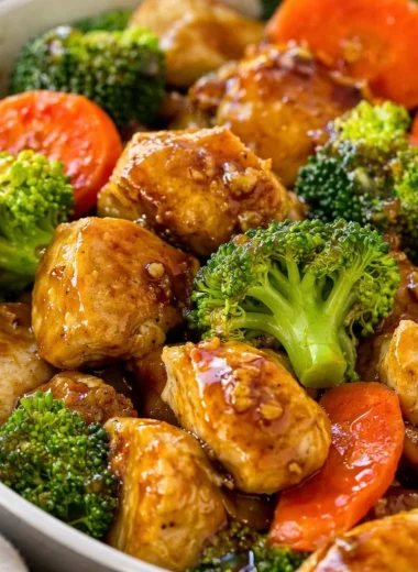 Delicious honey garlic chicken stir fry featuring tender chicken, broccoli, and carrots.