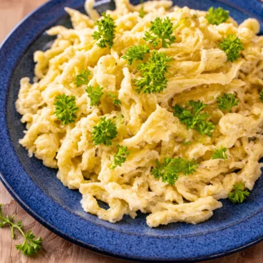 A bowl of Authentic German Spaetzle, traditional egg noodles served with gravy.