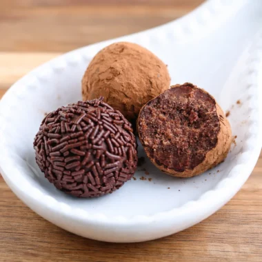 Traditional German Rum Balls (Rumkugeln) covered in chocolate sprinkles.