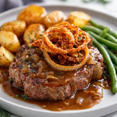 Traditional Zwiebelrostbraten - German onion beef roast with crispy onions and rich gravy
